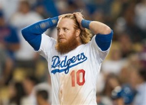 Los Angeles Dodgers' Justin Turner walks away after striking out with a runner on first to end the seventh inning during the Dodgers' 3-2 loss to the New York Mets in Game 5 of the National League Division Series, Thursday, Oct. 15, 2015, in Los Angeles. (Kevin Sullivan/The Orange County Register via AP)